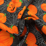 Tissu coton citrouilles d'halloween sur fond noir
