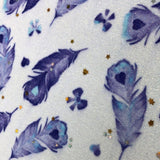 Toile paillette imperméable motifs plumes bleues